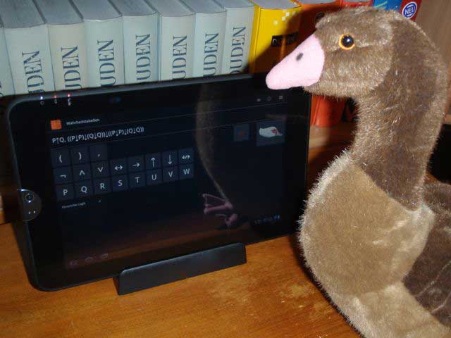 [A goose using logic software on a tablet computer]